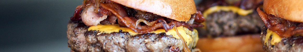 Eating Burger at Barney's Better Burgers restaurant in Medford, OR.